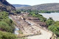 Backhoe loaders clearing sand that blocked canal at Boegoeberg Dam