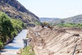 Backhoe loaders clearing sand blocking canal at Boegoeberg Dam