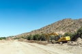 Backhoe loaders clearing sand from Boegoeberg Dam canal