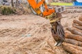 Backhoe log grapple attachment Royalty Free Stock Photo