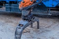 Backhoe log grapple attachment