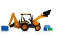 Backhoe tractor with brick toys, white background