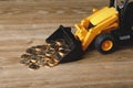 Backhoe tractor rake up money coins