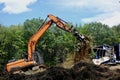 Backhoe at work in a forest