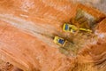 Backhoe working by digging soil at bucket teeth of backhoe digging soil and loads a dump truck with earth