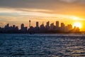 Backlight skyline of Sydney CBD from the bay at sunset Royalty Free Stock Photo