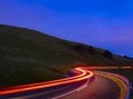 Backlights, car driving at speed at night on road Royalty Free Stock Photo