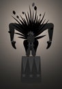 Backlist silhouette of contortionist dressed in a feather headdress, balancing on a stand