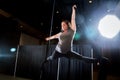 Backlit Aerialist In Split Pose