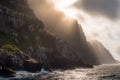 backlit coastal cliffs with streaks of sunlight and clouds