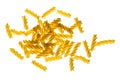 Backlit dried raw, uncooked spirelli pasta noodles