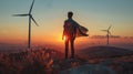 Backlit figure in a cape stands before wind turbines, evoking sustainable energy& x27;s heroes