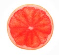 Red grapefruit slice backlit, isolated on white