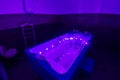 Backlit hot tub for relaxation and rehabilitation spa treatments in a medical clinic Royalty Free Stock Photo