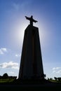 Backlit image with the silhouette of the famous Cristo-Rei or King-Christ Sanctuary in Almada. Royalty Free Stock Photo