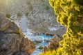 Backlit, natural framed scene of the Hot Creek Geological Site, focus on the teal water Royalty Free Stock Photo