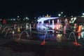 Backlit night fountain in a big city Royalty Free Stock Photo