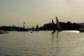 Backlit photo at the sunset of the Nile river near Cairo with silhouettes of the typical sailing boats of the Nile river called