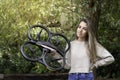 Backlit portrait of a Caucasian girl showing to the camera her new quadricopter drone of initiation in the nature Royalty Free Stock Photo