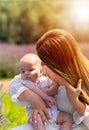 Backlit portrait if a loving mother and baby Royalty Free Stock Photo