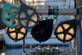 Backlit pulleys on a commercial fishing boat glow in the light of the setting sun Royalty Free Stock Photo