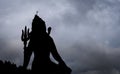 backlit shot of hindu god shiva with dramatic background