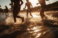 Backlit shot of teenagers running, having fun, playing and splashing water around them. At the beach during a sunny afternoon