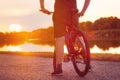 Silhouette of cyclist ready to ride in the sunset Royalty Free Stock Photo