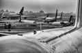 Backlit view of airplanes on the airport runway at sunset. Travel around the world concept