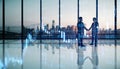 Backlit young businesspeople working together in modern office interior with panoramic city view, glowing forex big data index Royalty Free Stock Photo