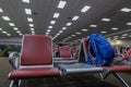 Backpack bag leave on the chair in terminal airport waiting for boarding time