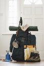 Backpack and camping equipment in hallway