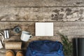 Backpack and hiking equipment on wooden background, top view Royalty Free Stock Photo