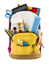 Backpack isolated on white backgorund with protruding school supplies Royalty Free Stock Photo