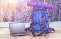 Backpack laptop and camera in winter background