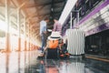 Backpack, luggage and hat over travellers at train station. Travel concept Royalty Free Stock Photo