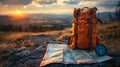 Backpack, map and compass on the background of the horizon. Royalty Free Stock Photo