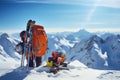 A backpack and a pair of skis positioned on the peak of a snow-covered mountain, Ski in winter season, mountains and ski touring Royalty Free Stock Photo