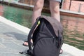 Backpack on the road. Boy with Backpack Walking On Street. Burano, Venice Italy, Europe. Summer wacation ideas. Historical city.