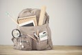 Backpack school supplies on table emtpy background Royalty Free Stock Photo