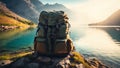 Backpack at the shore of beautiful scenic mountain lake Royalty Free Stock Photo