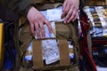 Backpack with soldier s first aid kit: bandages, wound-healing drugs, balloon with burn-treating gel, painkillers