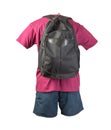 Backpack, sports shorts, t-shirt on white foane. clothes for every day