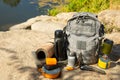 Backpack, thermos, gas burner, sleeping mat, knife, compass and tourist utensils in the mountains. Royalty Free Stock Photo