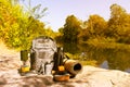 Backpack, thermos, gas burner, sleeping mat, knife, compass and tourist utensils in the mountains. Royalty Free Stock Photo