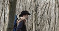 Backpacked Male Tourist in Forest