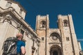 A backpacker is arriving at SÃÂ© Cathedral in Lisbon, Portugal