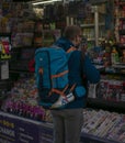 Backpacker buying a soda