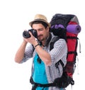 Backpacker with camera isolated on white background Royalty Free Stock Photo