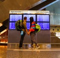 Backpacker couple at the airport in Doha